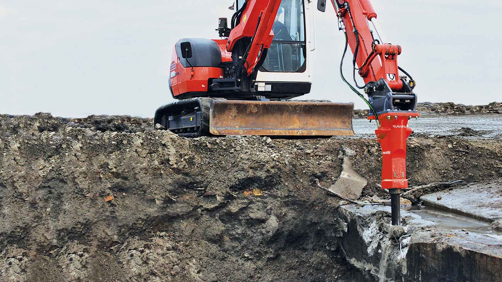 Engin de terrassement Cogelas préparant une plateforme de chantier